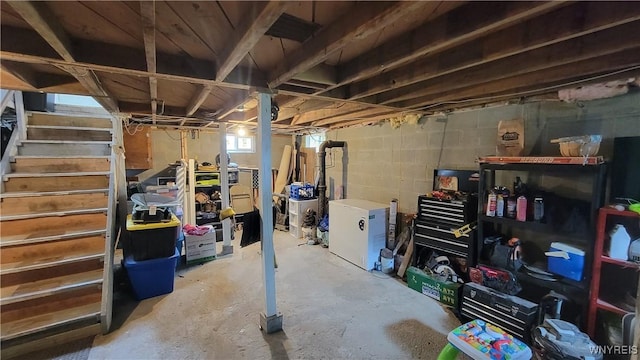 11 Parkview Ct, Arcade, NY 14009 - below grade area featuring stairway, fridge, and concrete block wall