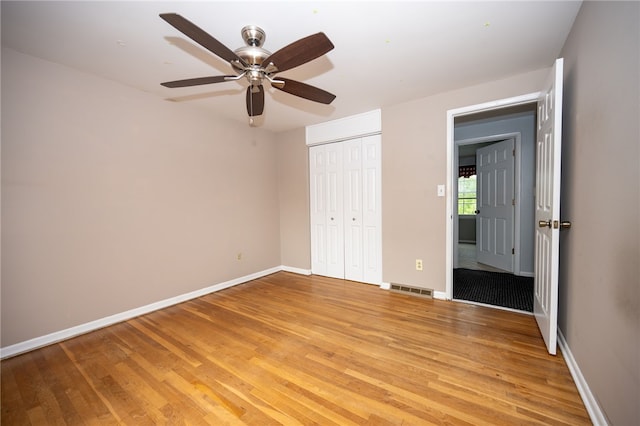30 Sibley Dr, West Seneca, NY 14224 - unfurnished bedroom with light wood-type flooring, a closet, baseboards, and a ceiling fan