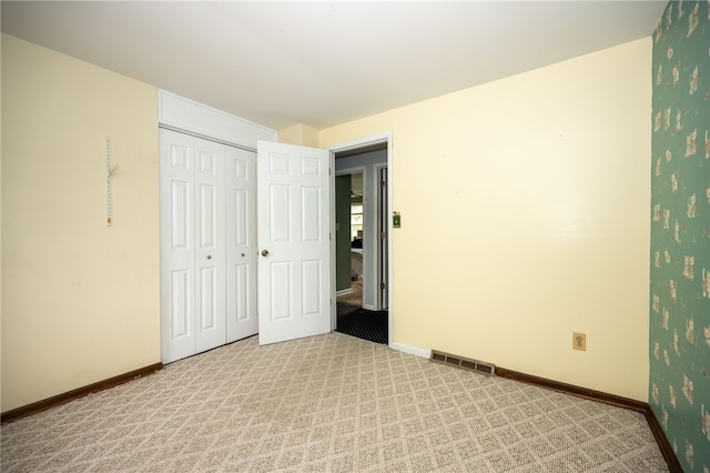 30 Sibley Dr, West Seneca, NY 14224 - unfurnished bedroom featuring light colored carpet, baseboards, and a closet