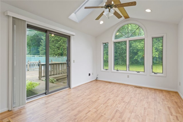 69 Tree Brook Dr, Penfield, NY 14625 - spare room with plenty of natural light, a ceiling fan, light wood-type flooring, a skylight, and lofted ceiling