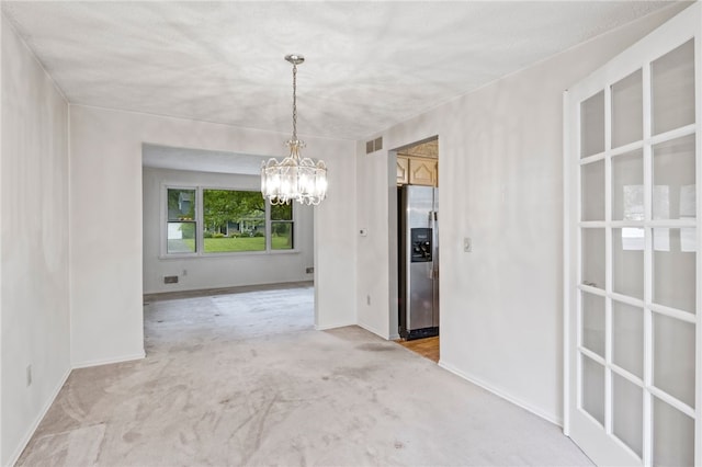 69 Tree Brook Dr, Penfield, NY 14625 - unfurnished dining area featuring a chandelier, light carpet, and baseboards