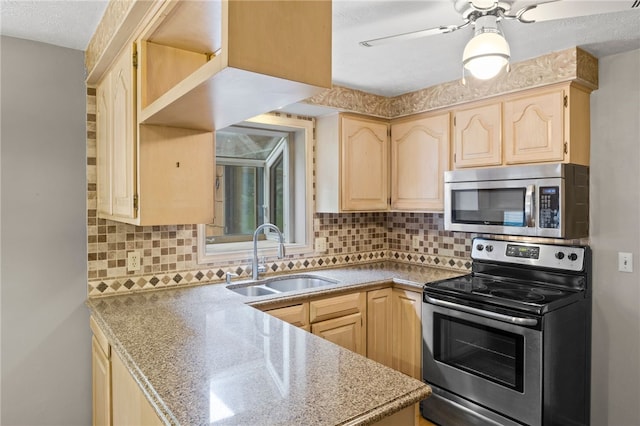 69 Tree Brook Dr, Penfield, NY 14625 - kitchen featuring stainless steel appliances, light brown cabinets, a sink, tasteful backsplash, and a ceiling fan