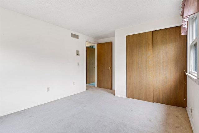 69 Tree Brook Dr, Penfield, NY 14625 - unfurnished bedroom featuring carpet flooring and a closet