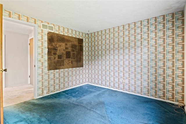 69 Tree Brook Dr, Penfield, NY 14625 - carpeted empty room featuring wallpapered walls and a textured ceiling