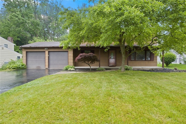 69 Tree Brook Dr, Penfield, NY 14625 - view of front of home featuring driveway, an attached garage, and a front lawn