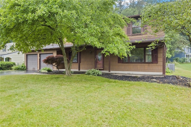 69 Tree Brook Dr, Penfield, NY 14625 - obstructed view of property with a front yard and asphalt driveway