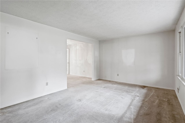 69 Tree Brook Dr, Penfield, NY 14625 - carpeted empty room featuring a textured ceiling