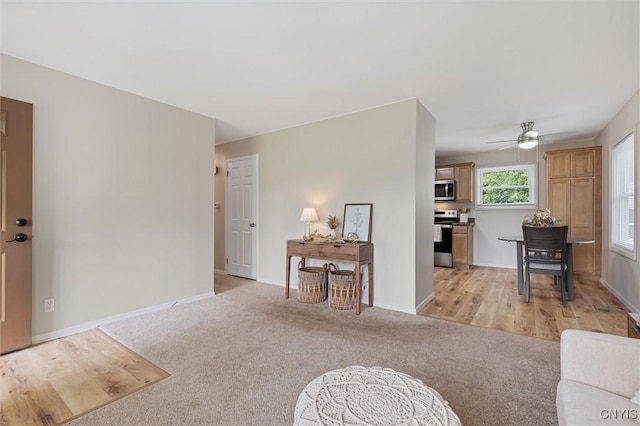 109 Blanchard Blvd, Van Buren, NY 13209 - living room with ceiling fan, baseboards, and light carpet