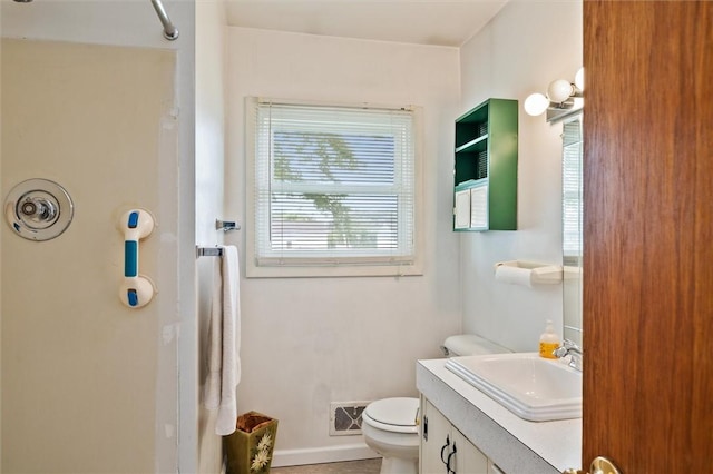 176 Wildbriar Rd, Henrietta, NY 14623 - bathroom featuring toilet, a shower, vanity, and baseboards