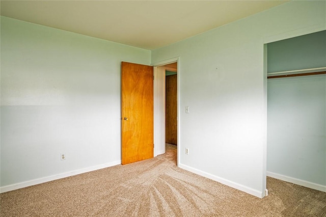 176 Wildbriar Rd, Henrietta, NY 14623 - unfurnished bedroom with carpet flooring, a closet, and baseboards
