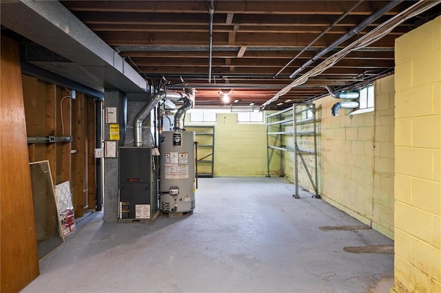 176 Wildbriar Rd, Henrietta, NY 14623 - below grade area featuring gas water heater, heating unit, and plenty of natural light
