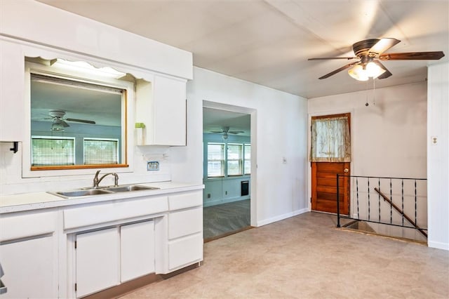176 Wildbriar Rd, Henrietta, NY 14623 - kitchen with a sink, a ceiling fan, white cabinetry, and light countertops