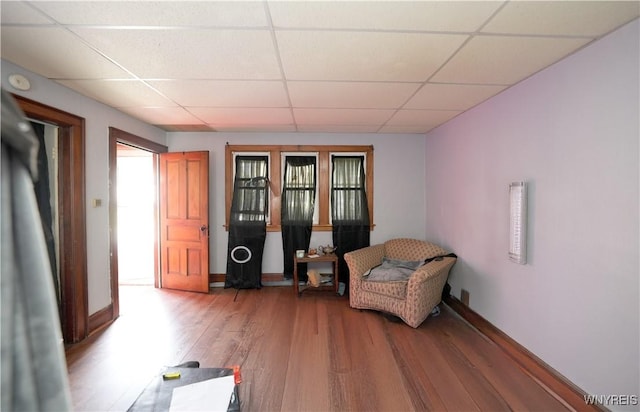 132 Weiss St, Buffalo, NY 14206 - sitting room with a drop ceiling, wood finished floors, and baseboards