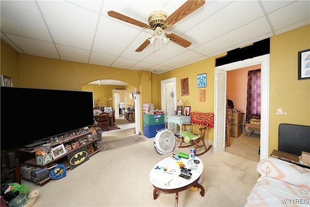 132 Weiss St, Buffalo, NY 14206 - living area with a drop ceiling, carpet, arched walkways, and ceiling fan