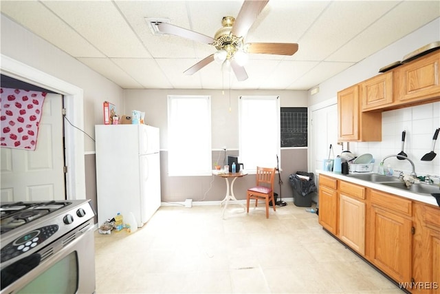 132 Weiss St, Buffalo, NY 14206 - kitchen with stainless steel range oven, freestanding refrigerator, ceiling fan, a sink, and light countertops