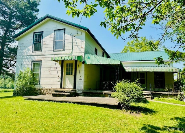 11920 Clarence Center Rd, Newstead, NY 14001 - rear view of house featuring a yard and metal roof
