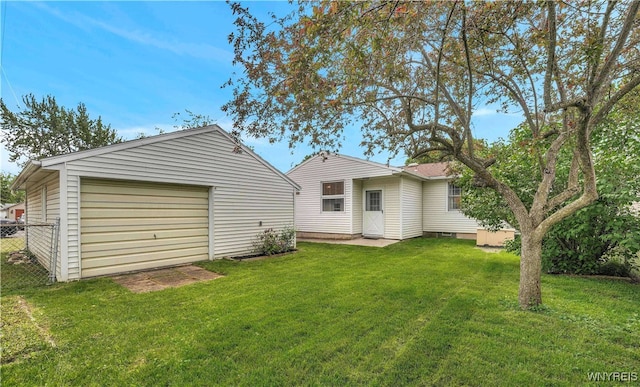 63 Princeton Ct, Cheektowaga, NY 14225 - rear view of property with an outbuilding and a garage