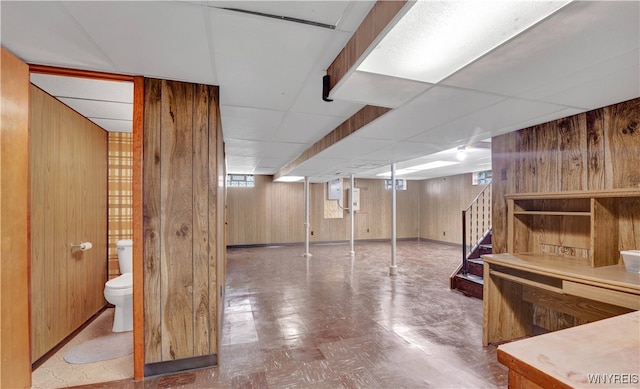 63 Princeton Ct, Cheektowaga, NY 14225 - basement featuring stairs, wooden walls, and tile patterned floors