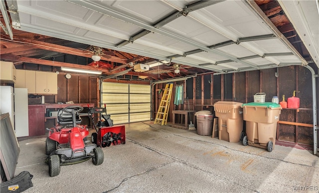 63 Princeton Ct, Cheektowaga, NY 14225 - garage featuring a garage door opener and freestanding refrigerator