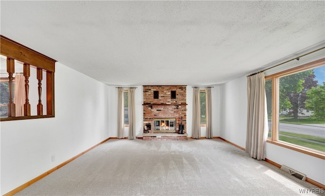 63 Princeton Ct, Cheektowaga, NY 14225 - unfurnished living room with a textured ceiling, carpet floors, a brick fireplace, and baseboards
