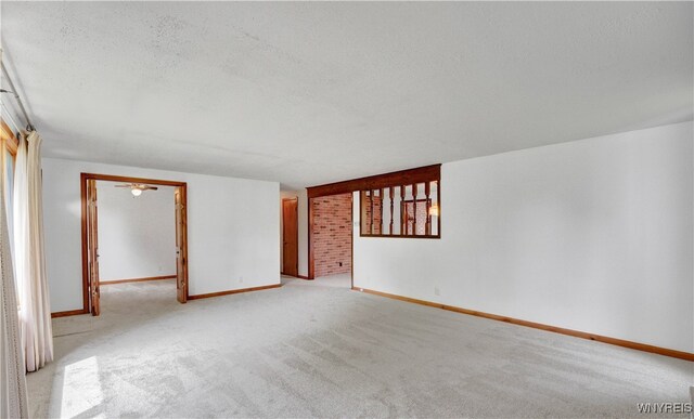 63 Princeton Ct, Cheektowaga, NY 14225 - spare room featuring baseboards, light carpet, and a textured ceiling