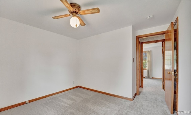 63 Princeton Ct, Cheektowaga, NY 14225 - spare room featuring baseboards, light colored carpet, a ceiling fan, and a smoke detector