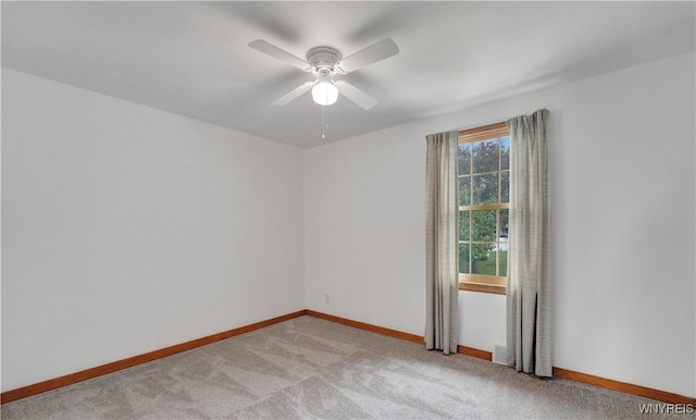 63 Princeton Ct, Cheektowaga, NY 14225 - spare room with light colored carpet, a ceiling fan, and baseboards