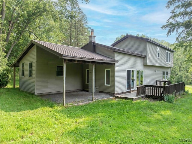 1010 Simmons Rd, Sterling, NY 13156 - back of house with a lawn, a patio, a carport, and a deck