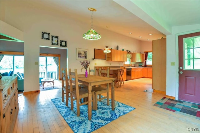 1010 Simmons Rd, Sterling, NY 13156 - dining area with plenty of natural light, light wood finished floors, baseboards, and recessed lighting