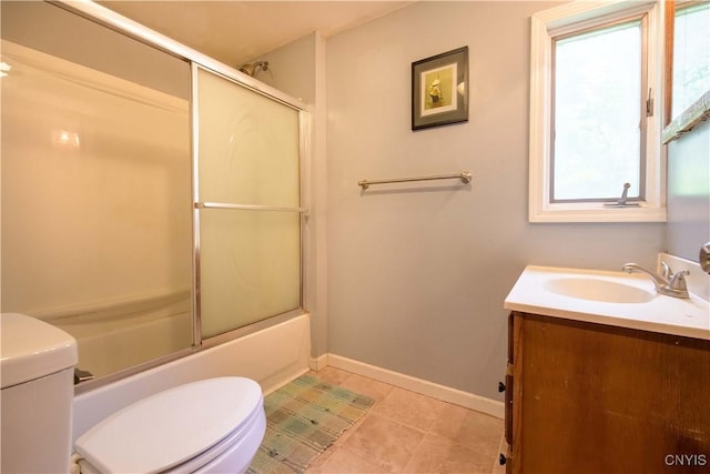 1010 Simmons Rd, Sterling, NY 13156 - full bathroom with toilet, vanity, shower / bath combination with glass door, baseboards, and tile patterned floors