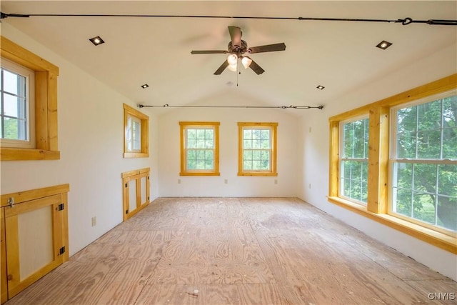 1010 Simmons Rd, Sterling, NY 13156 - empty room featuring healthy amount of natural light, vaulted ceiling, ceiling fan, and light wood-style floors