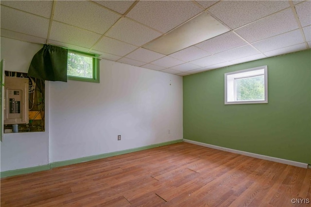 1010 Simmons Rd, Sterling, NY 13156 - basement with electric panel, wood finished floors, a paneled ceiling, and baseboards