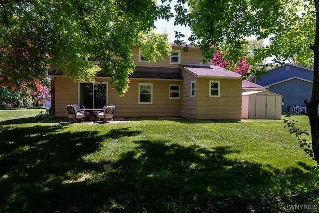 18 Tree Top Dr, Penfield, NY 14625 - back of house featuring a yard