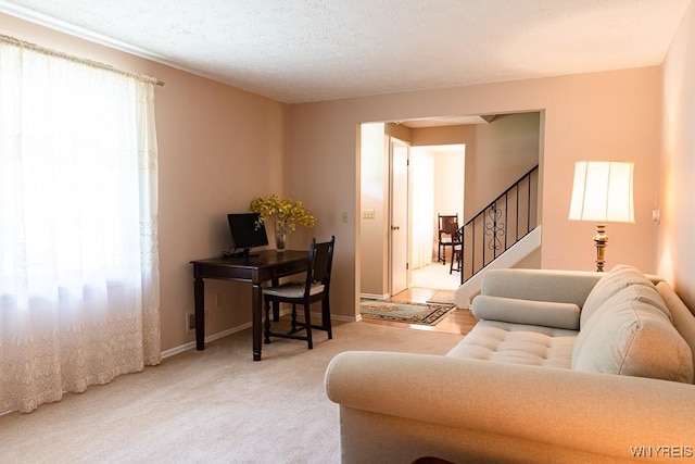 18 Tree Top Dr, Penfield, NY 14625 - living area with stairway, carpet, baseboards, and a textured ceiling
