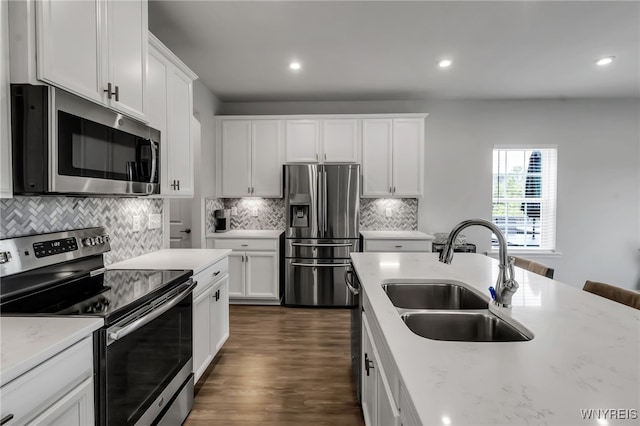 392 Quarry Run, Grand Island, NY 14072 - kitchen with stainless steel appliances, a sink, decorative backsplash, dark wood-type flooring, and recessed lighting