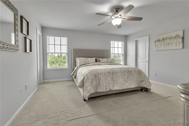392 Quarry Run, Grand Island, NY 14072 - bedroom featuring light carpet, multiple windows, baseboards, and ceiling fan