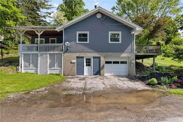 8471 Alpaugh Rd, Springwater, NY 14572 - view of home's exterior featuring an attached garage, asphalt driveway, and a deck