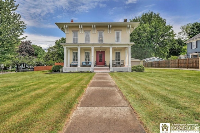 123 Central Ave, Pomfret, NY 14063 - italianate-style house with stucco siding, a porch, and a chimney
