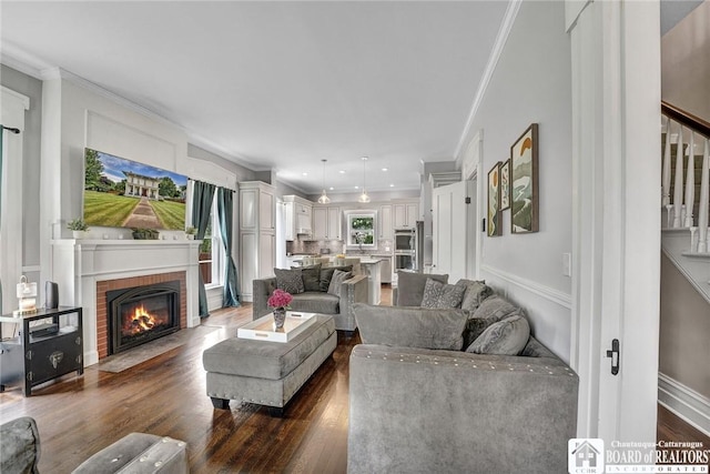 123 Central Ave, Pomfret, NY 14063 - living area featuring ornamental molding, dark wood finished floors, a fireplace, and stairway