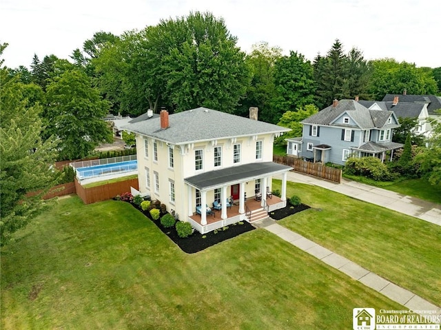123 Central Ave, Pomfret, NY 14063 - rear view of house with a chimney, a swimming pool, and covered porch