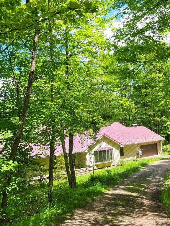 104 Mcclure Dr, Sanford, NY 13754 - view of front of home featuring driveway and a garage