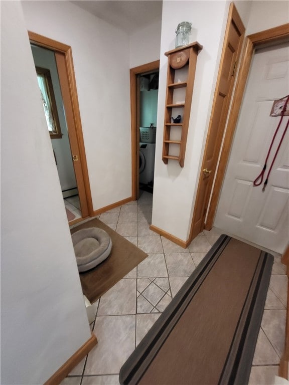 104 Mcclure Dr, Sanford, NY 13754 - bathroom with washer / clothes dryer, tile patterned flooring, and a baseboard radiator