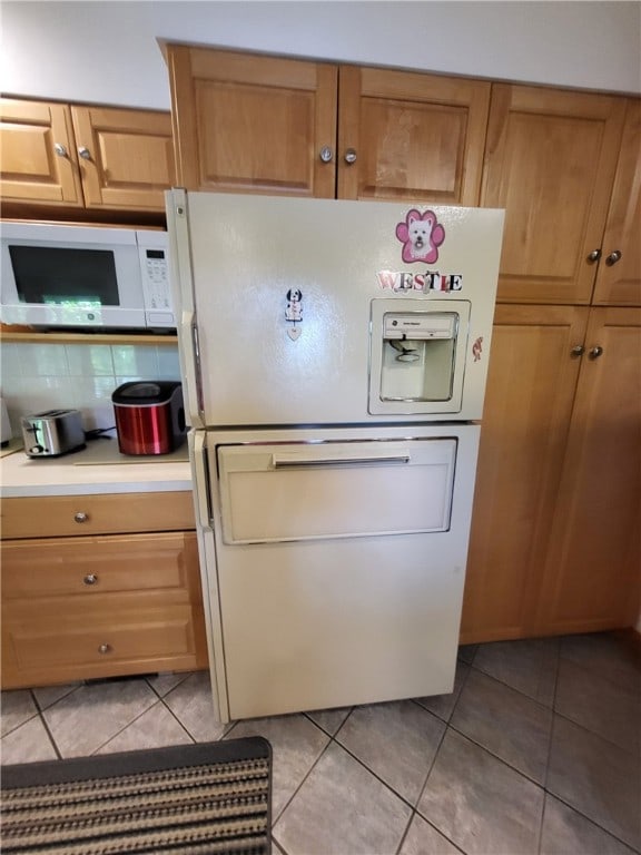 104 Mcclure Dr, Sanford, NY 13754 - kitchen featuring white appliances, light tile patterned floors, and light countertops