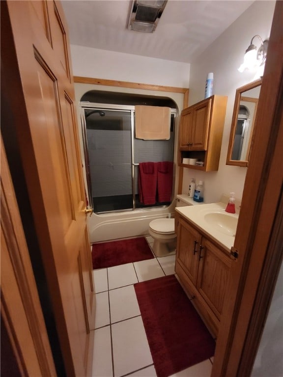 104 Mcclure Dr, Sanford, NY 13754 - full bathroom featuring vanity, bath / shower combo with glass door, and tile patterned flooring