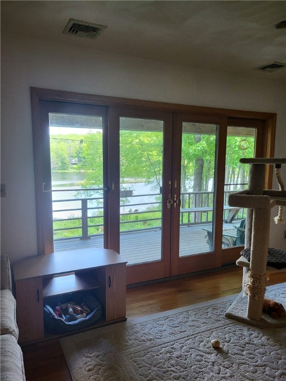 104 Mcclure Dr, Sanford, NY 13754 - doorway to outside with french doors and wood finished floors