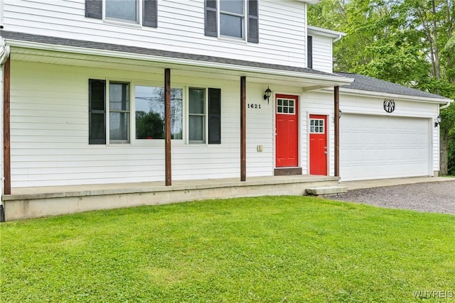 1621 Cain Rd, Brant, NY 14111 - doorway to property with covered porch, asphalt driveway, a lawn, and a garage