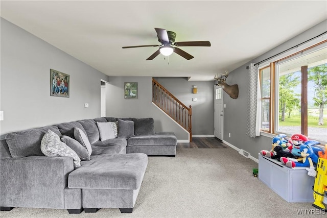 1621 Cain Rd, Brant, NY 14111 - living room with stairway, ceiling fan, carpet flooring, and baseboards