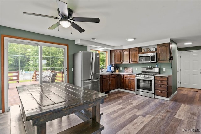 1621 Cain Rd, Brant, NY 14111 - kitchen featuring appliances with stainless steel finishes, light countertops, a ceiling fan, wood finished floors, and dark brown cabinets