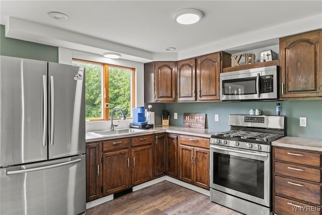 1621 Cain Rd, Brant, NY 14111 - kitchen featuring stainless steel appliances, light countertops, dark wood-type flooring, and a sink