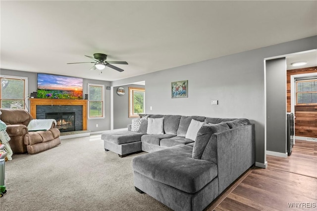 1621 Cain Rd, Brant, NY 14111 - living room with ceiling fan, healthy amount of natural light, baseboards, and a lit fireplace